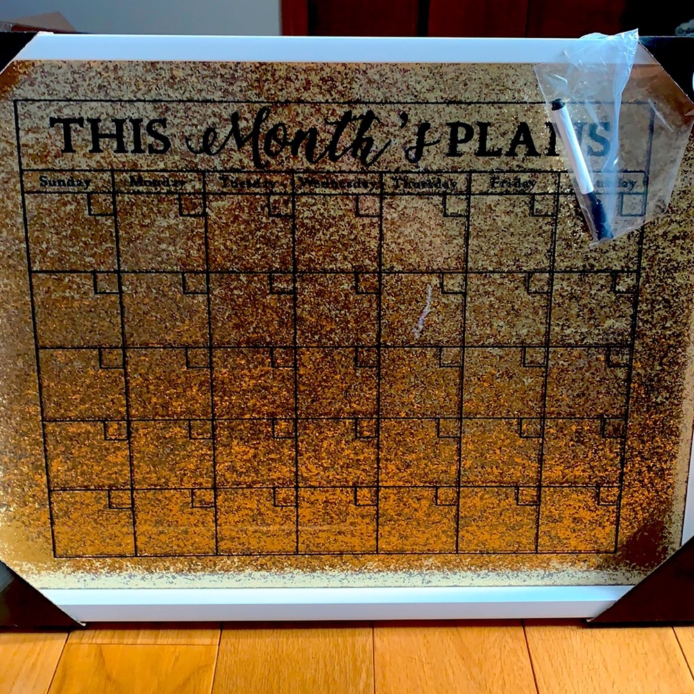 Cute gold monthly planner with erasable marker.